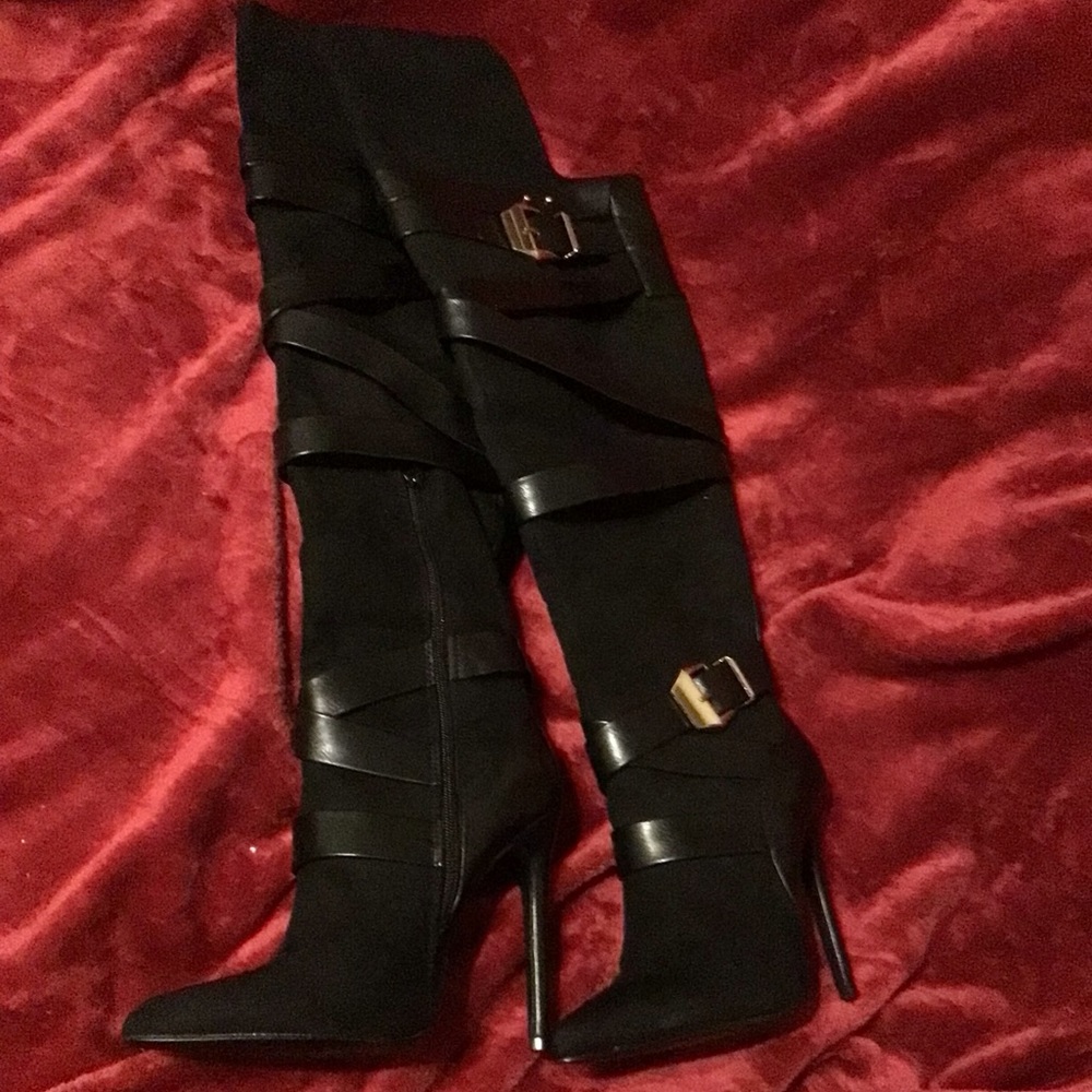 Black thigh high over knee strappy stiletto boots with gold buckles